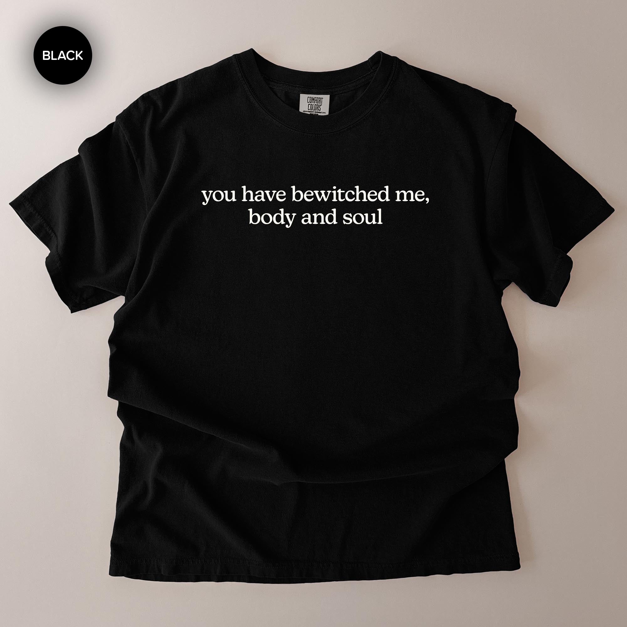 A black t-shirt with white text printed on it.