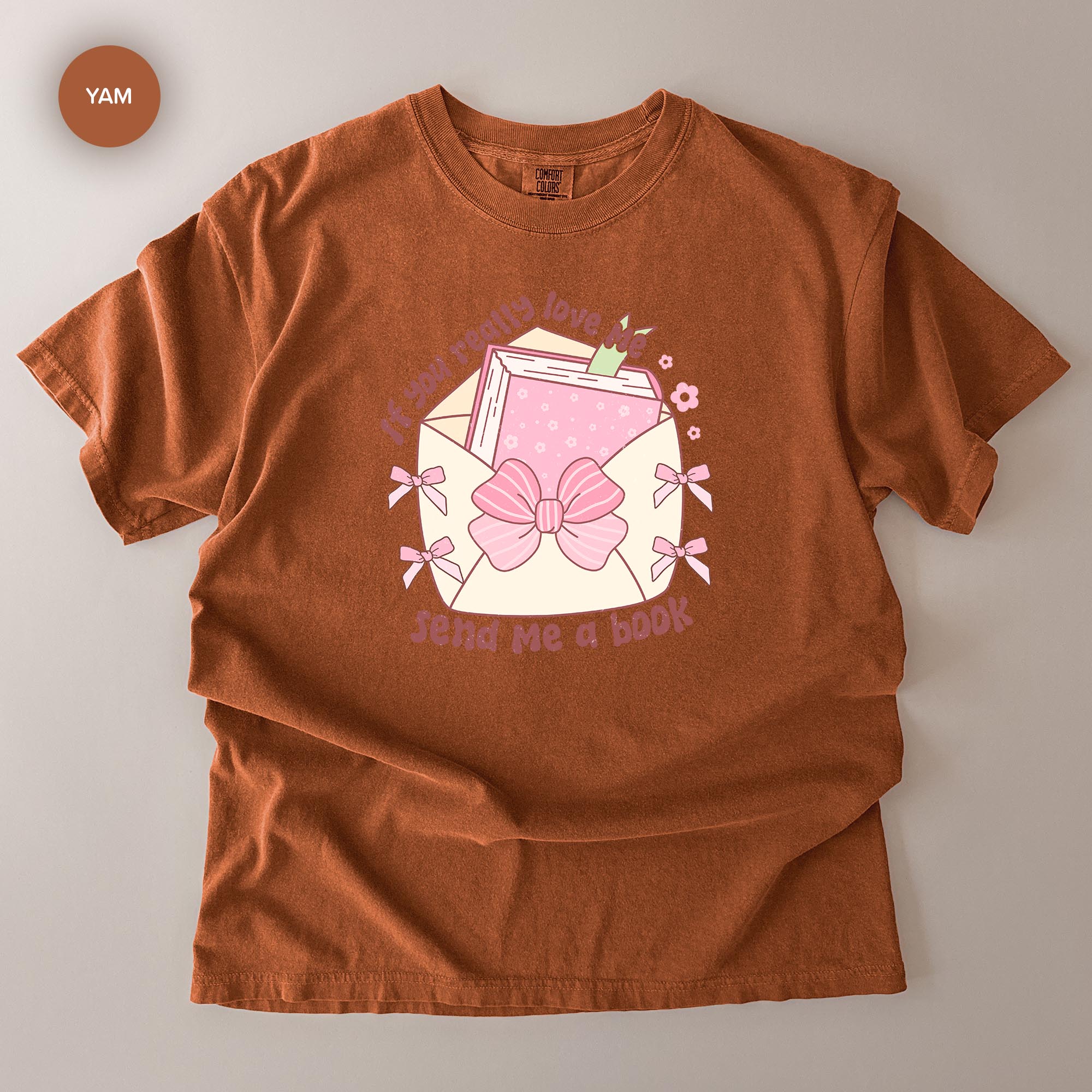 a brown t-shirt with a graphic design on it.