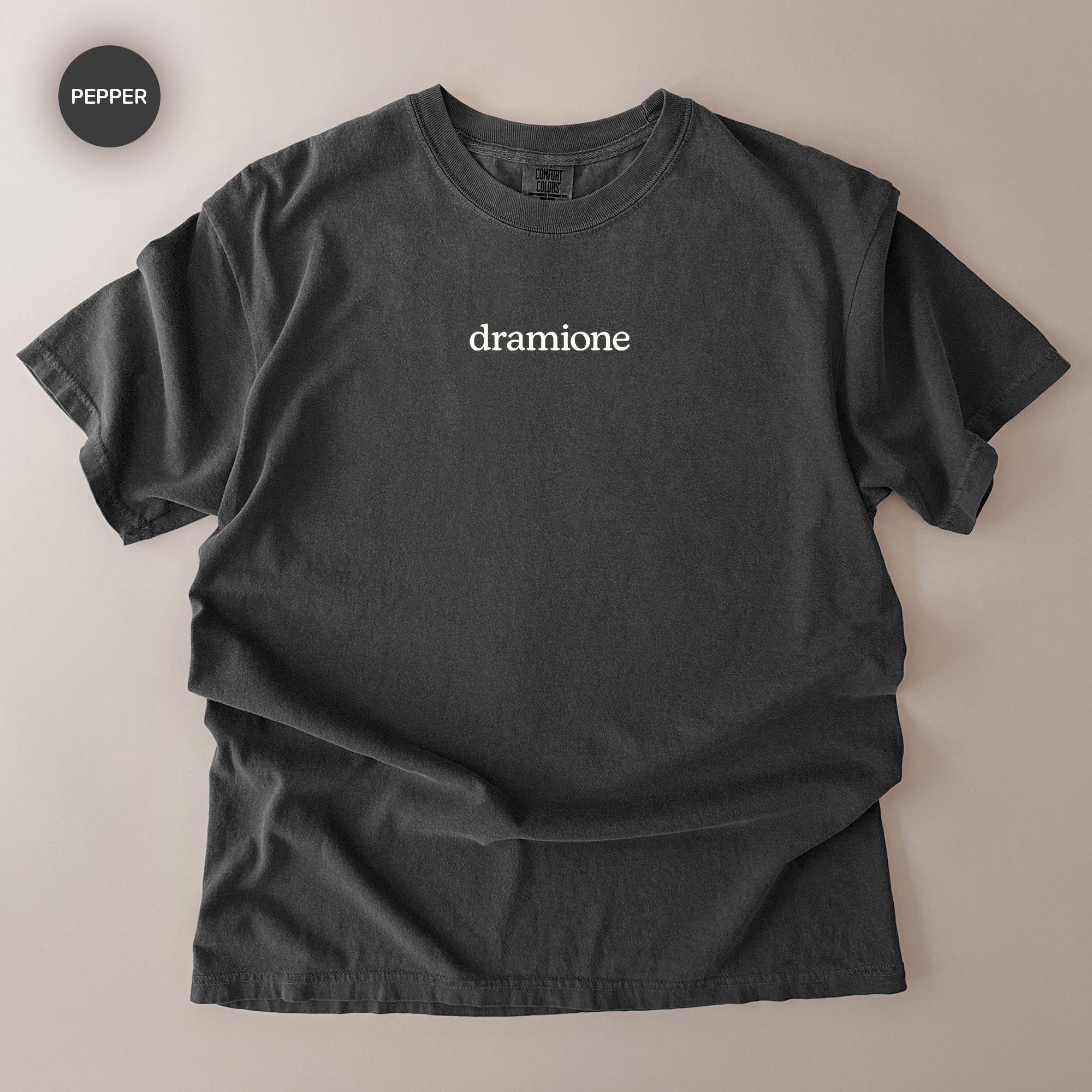 A black t-shirt with the word "dramione" printed on it.