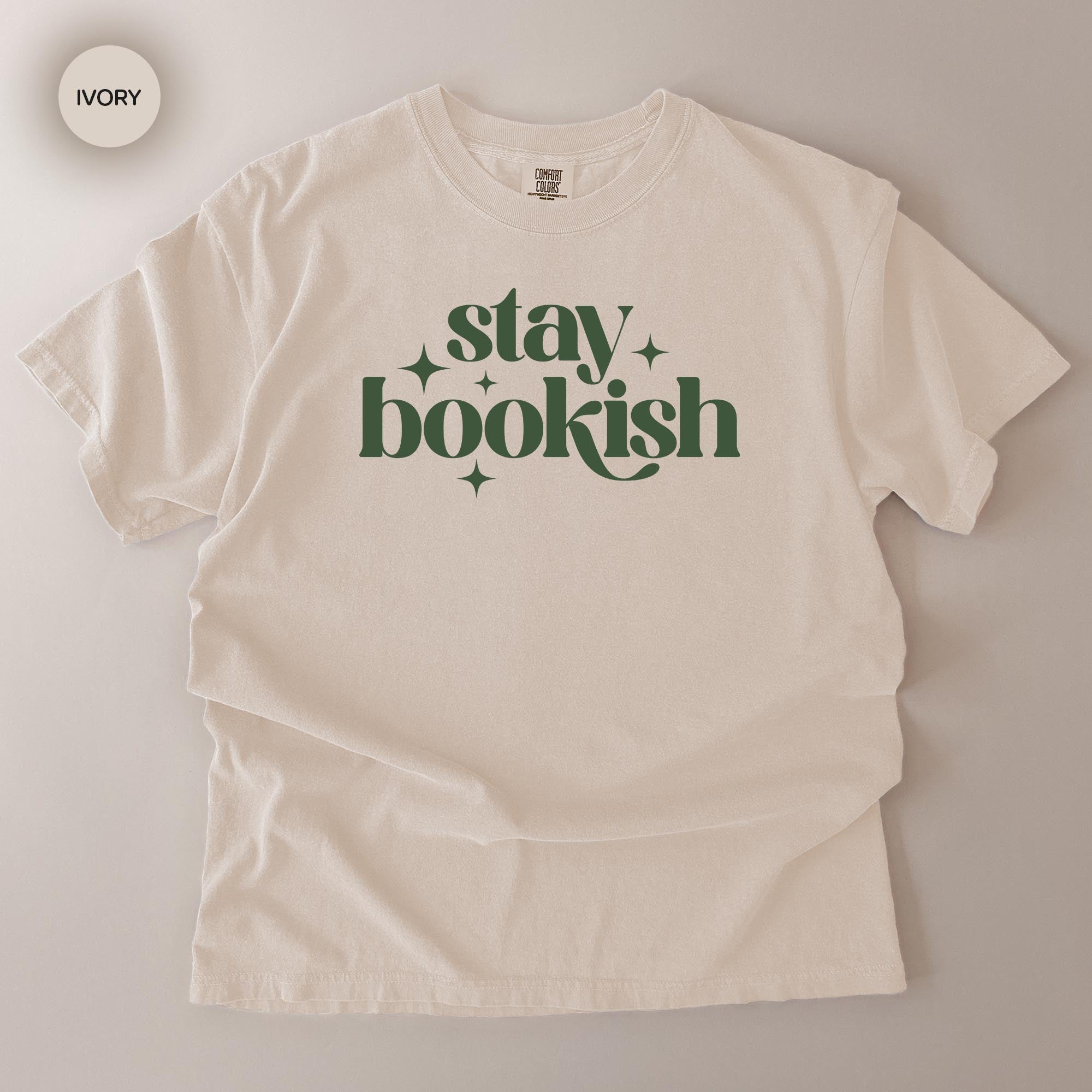 A white t-shirt with the text "stay bookish" printed on it in a stylized font.