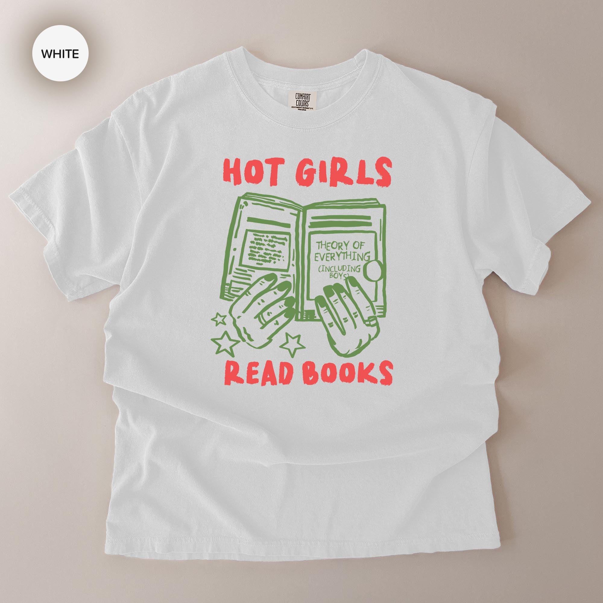 A white t-shirt with a graphic design featuring a pair of hands holding open a book, with the text "HOT GIRLS READ BOOKS" printed on it.