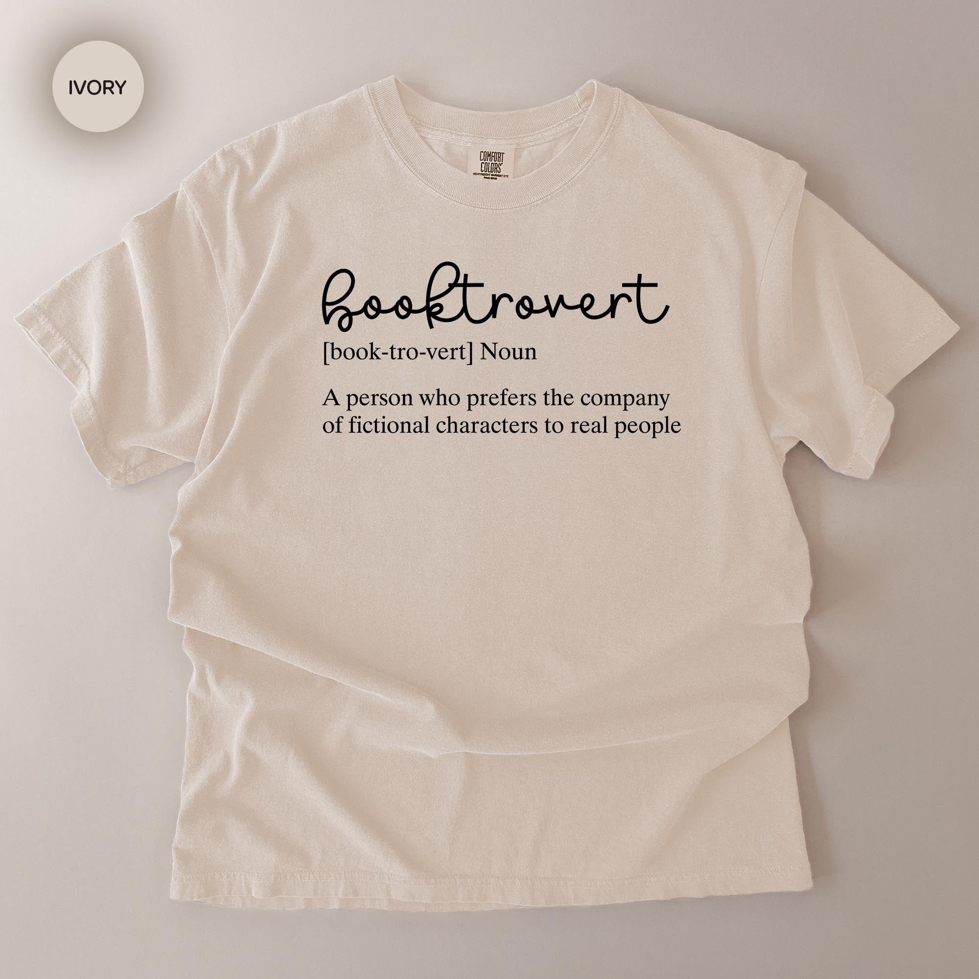 a white t-shirt with a definition of a book-trouvert printed on it.