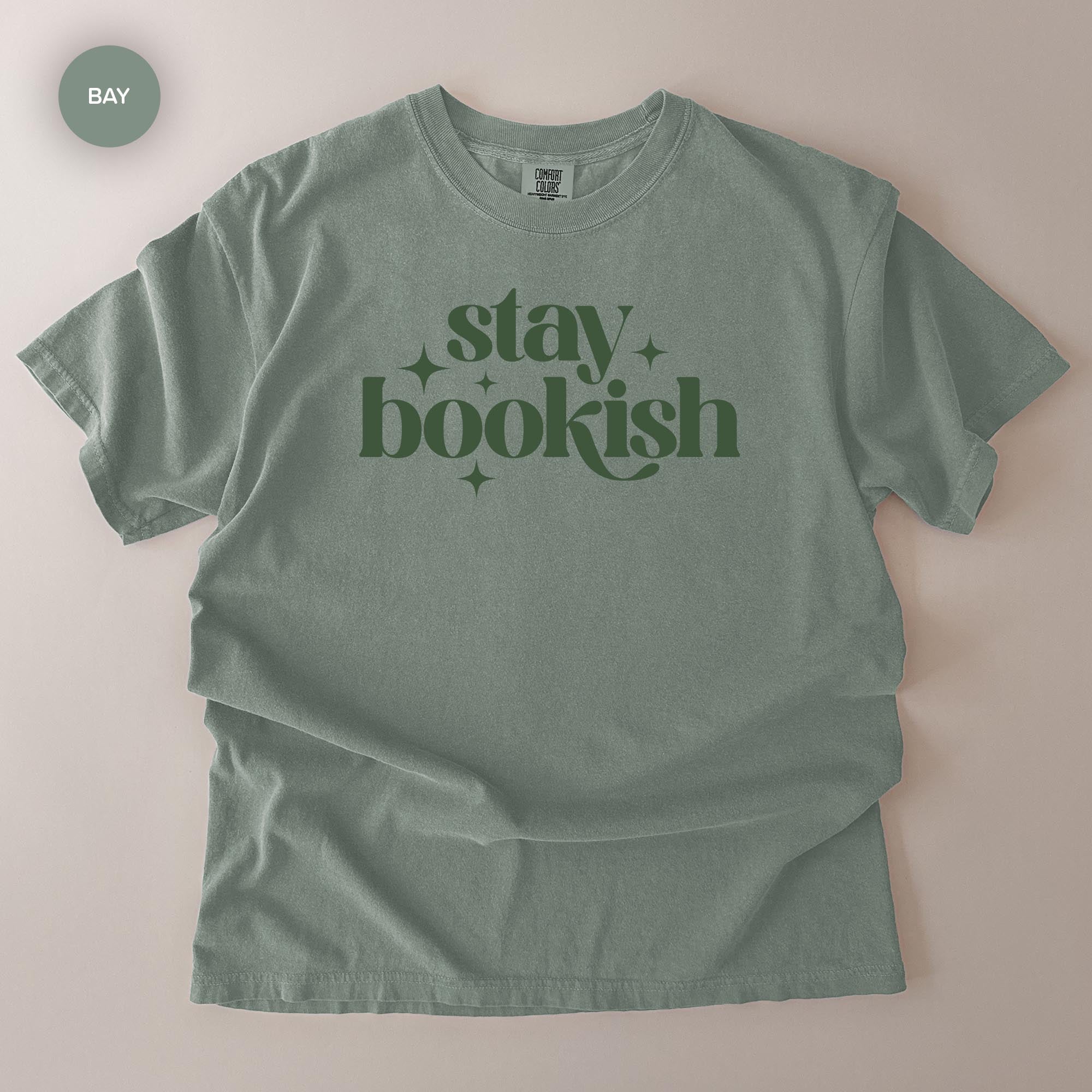 A gray t-shirt with the text "stay bookish" printed on it.