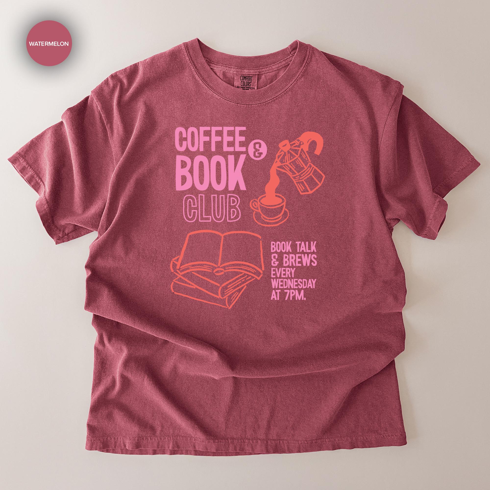 A red t-shirt with text and graphics related to a book club event.