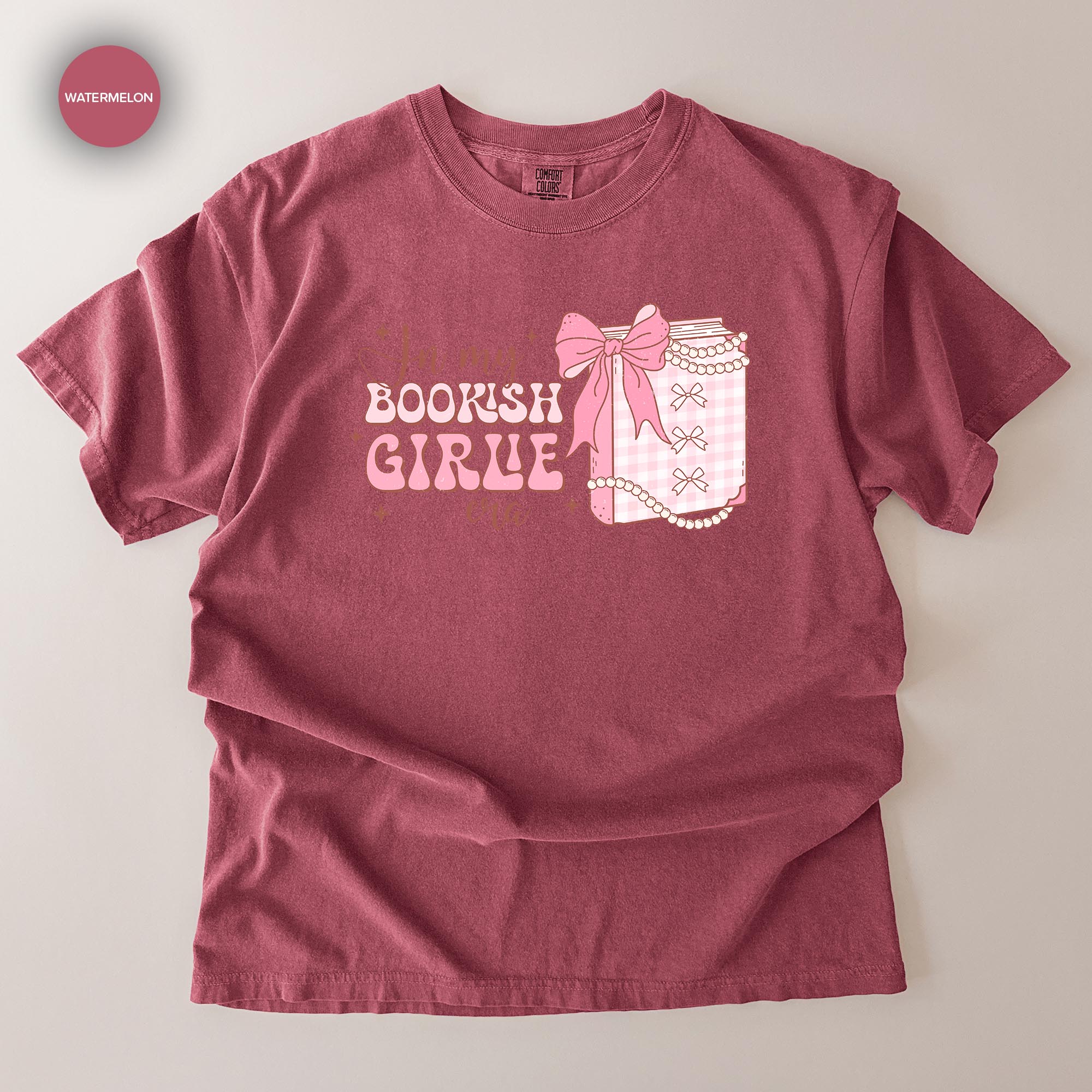 A red t-shirt with a graphic design that says "I'm a bookish girl" and features a bow and a book.