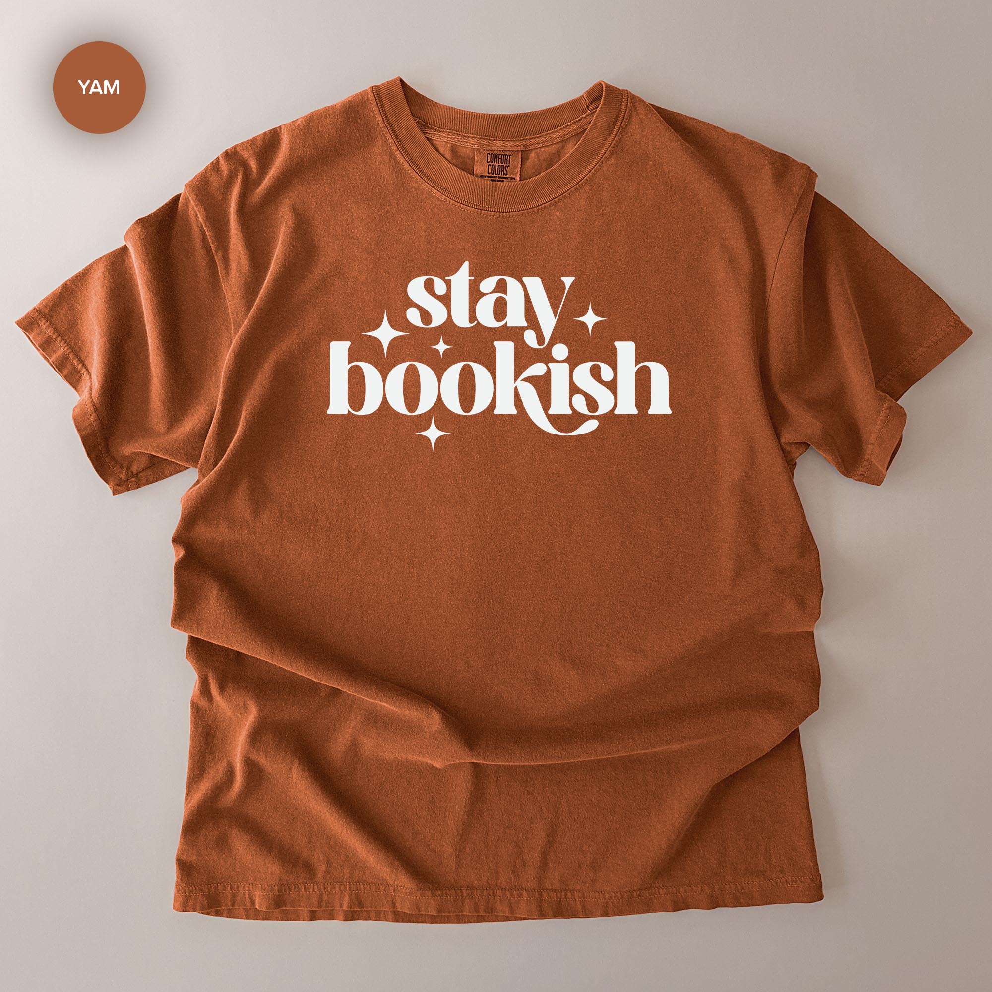 a red t-shirt with the text "stay bookish" printed on it.