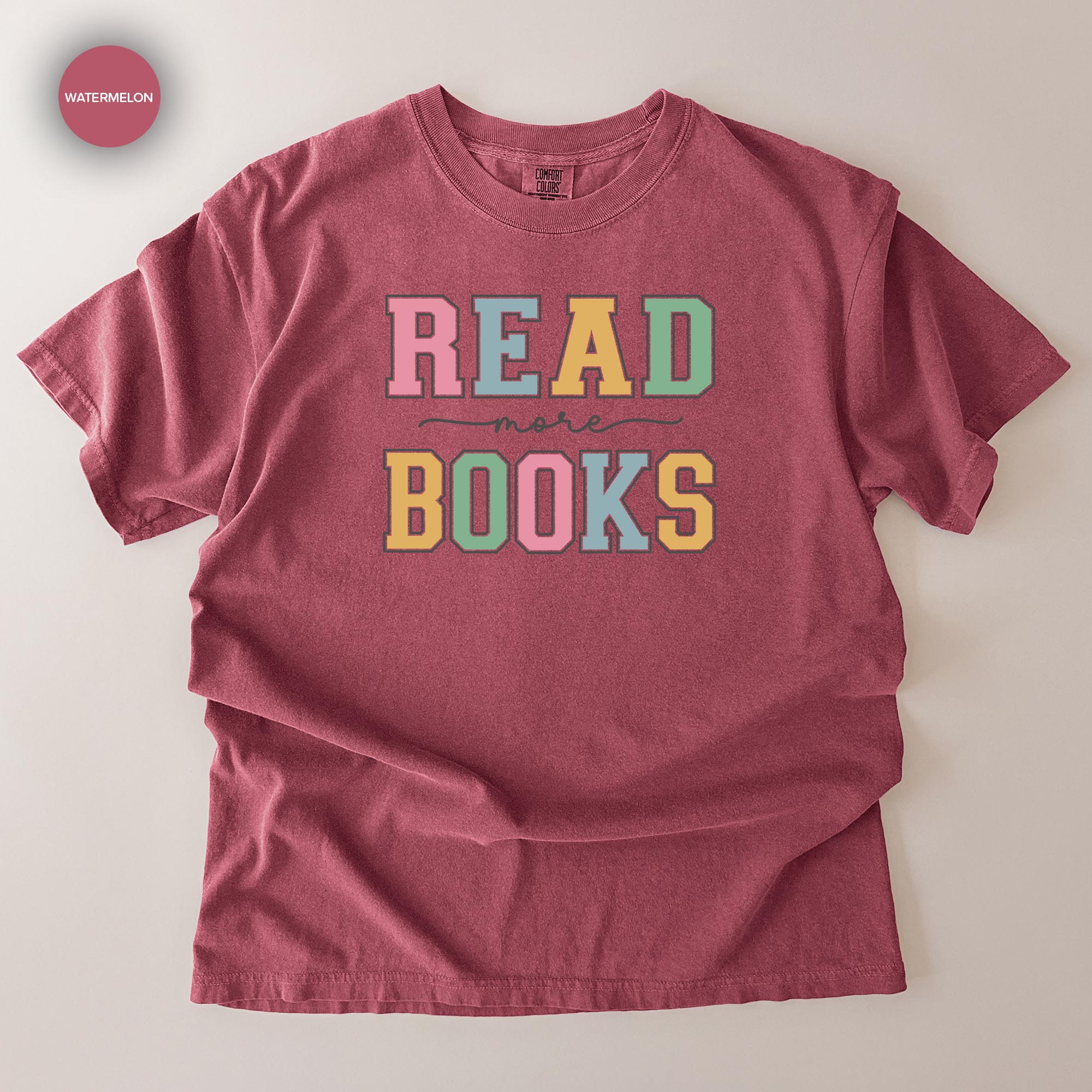 A red t-shirt with the text "READ MORE BOOKS" printed on it.