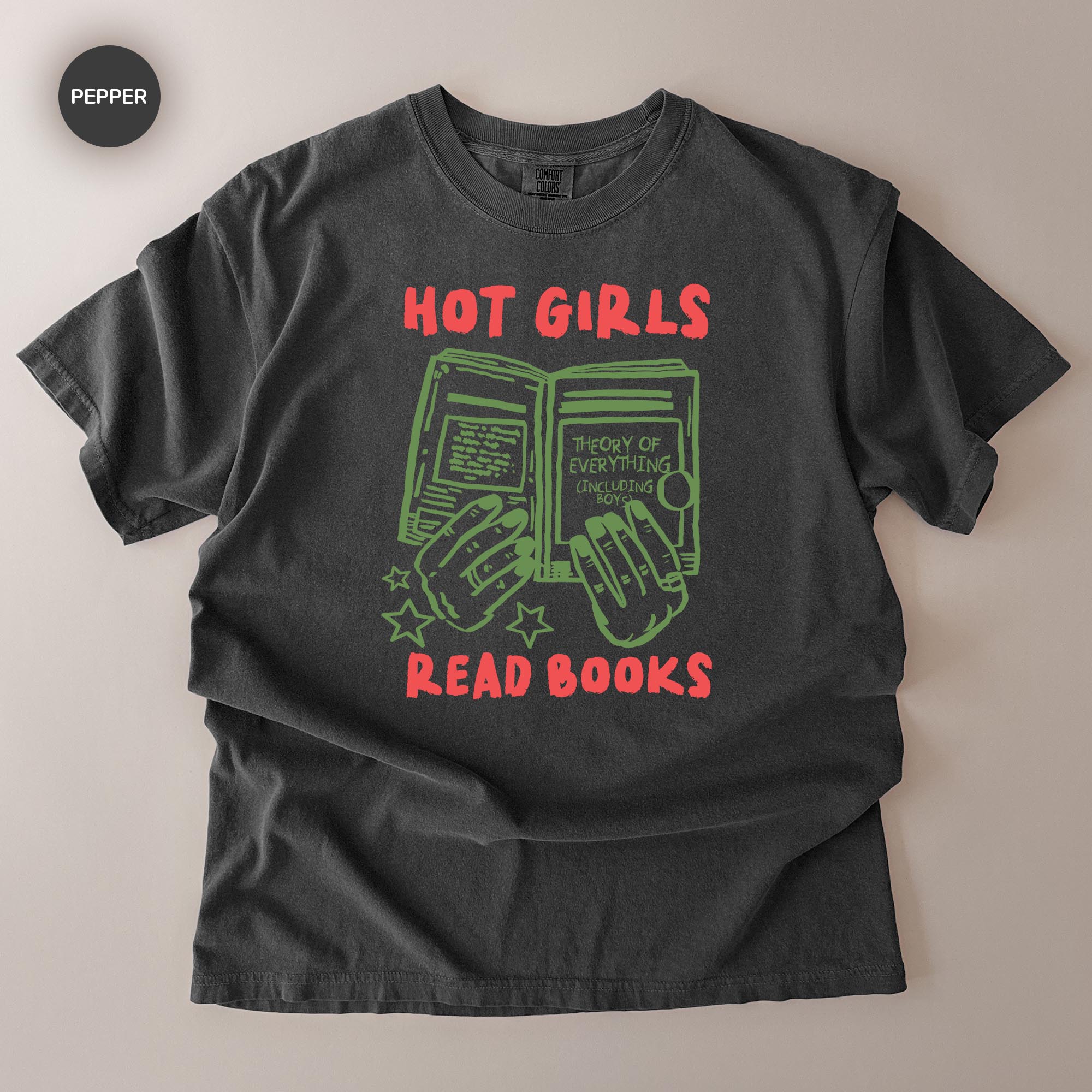 A black t-shirt with a graphic design featuring a book and the text "HOT GIRLS READ BOOKS" printed on it.