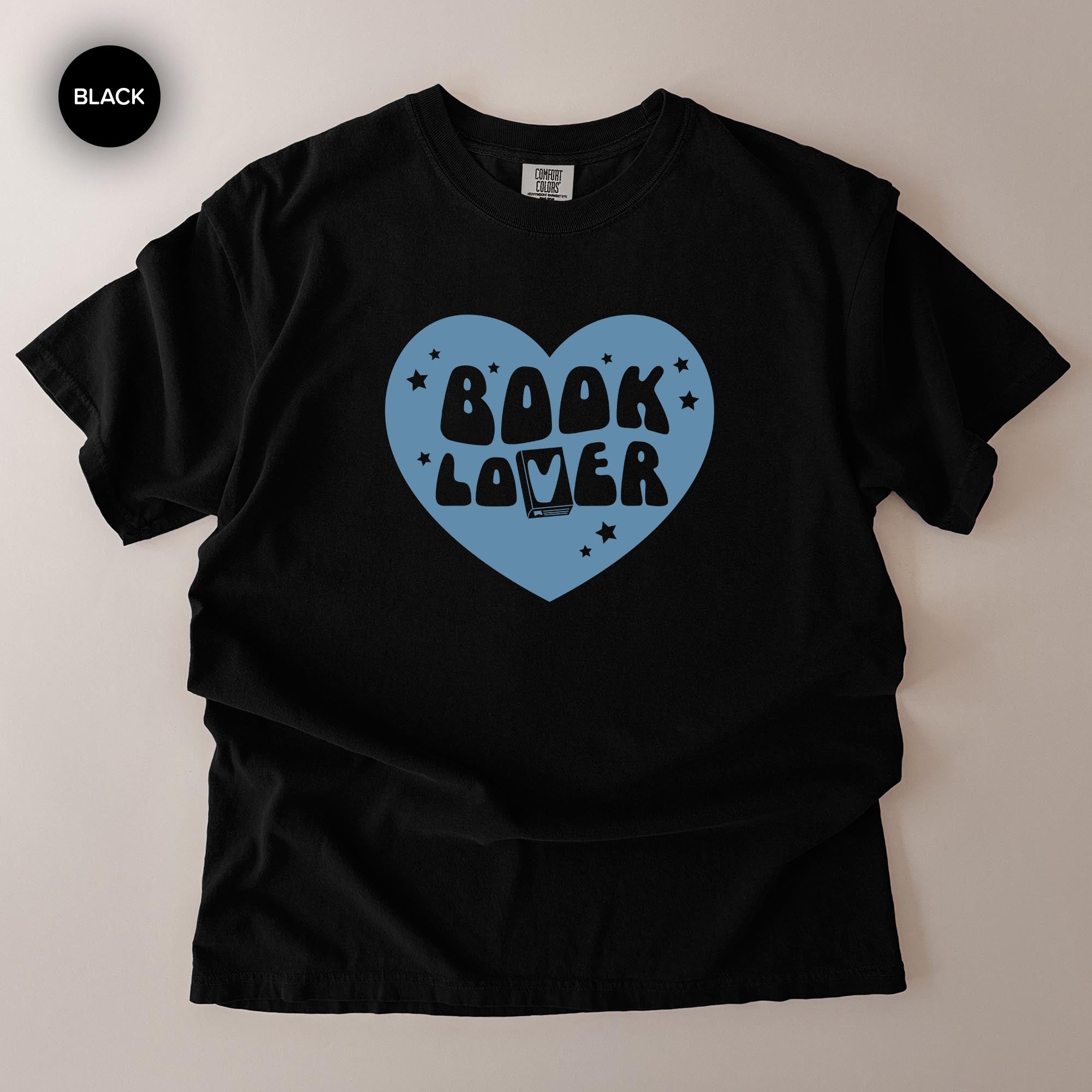 A black t-shirt with a blue heart-shaped graphic and the text "BOOK LOVER" printed on it.