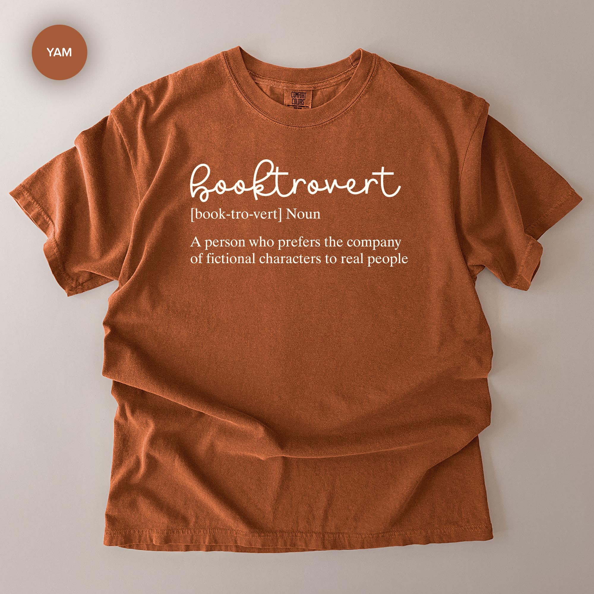 a red t-shirt with the definition of a book-loving person printed on it.