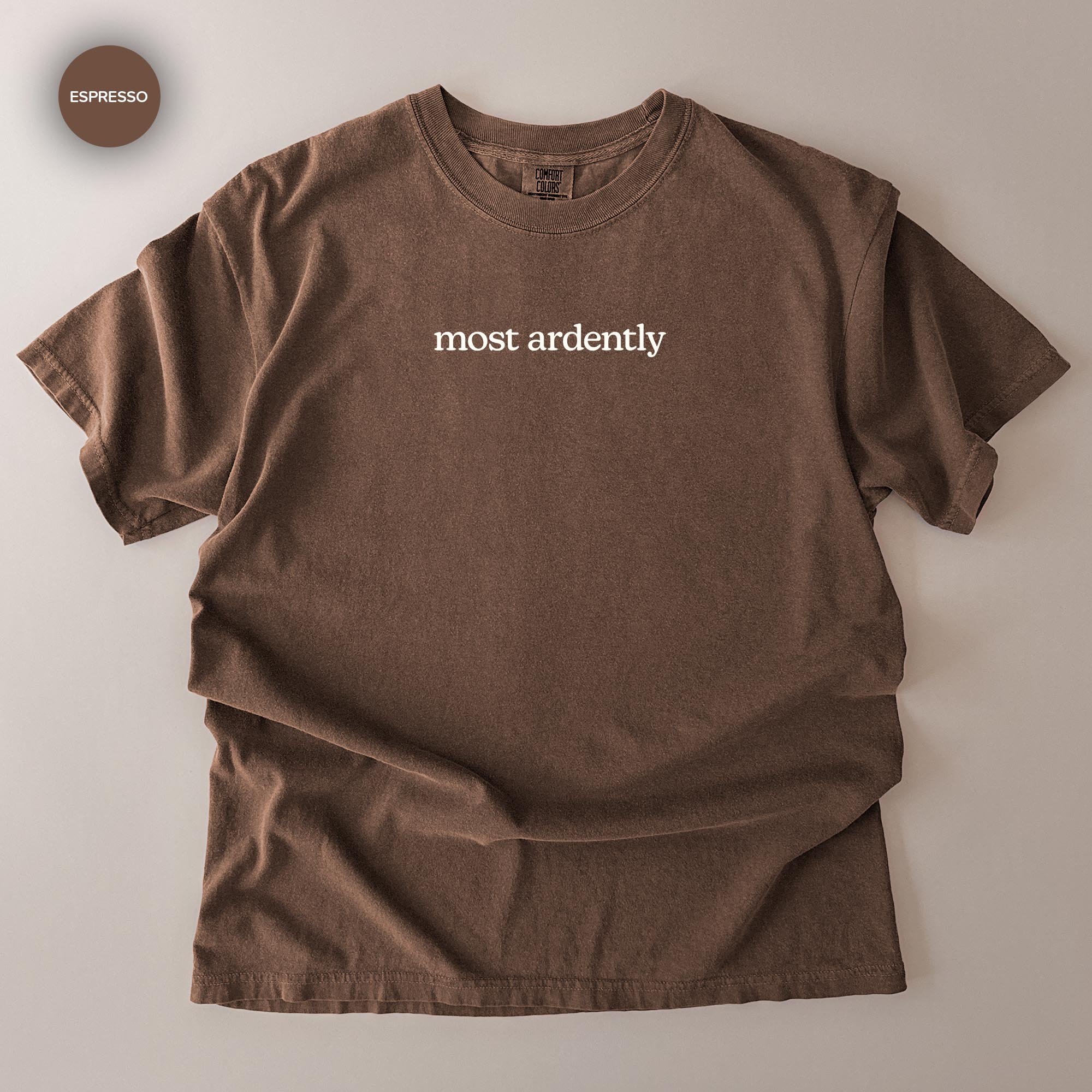 A brown t-shirt with the text "most ardently" printed on it.