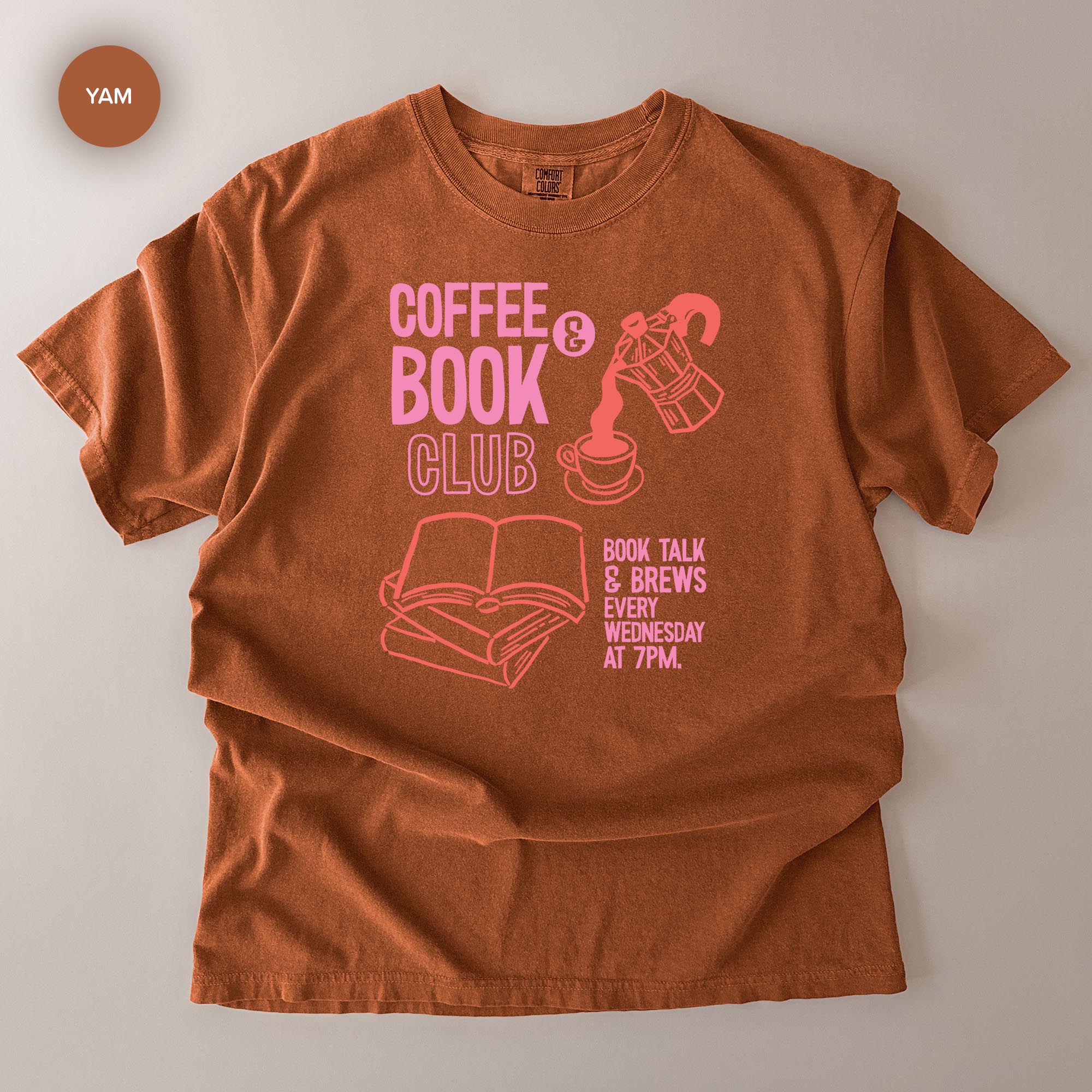 A brown t-shirt with a graphic design featuring a coffee cup, a book, and text promoting a book club event.