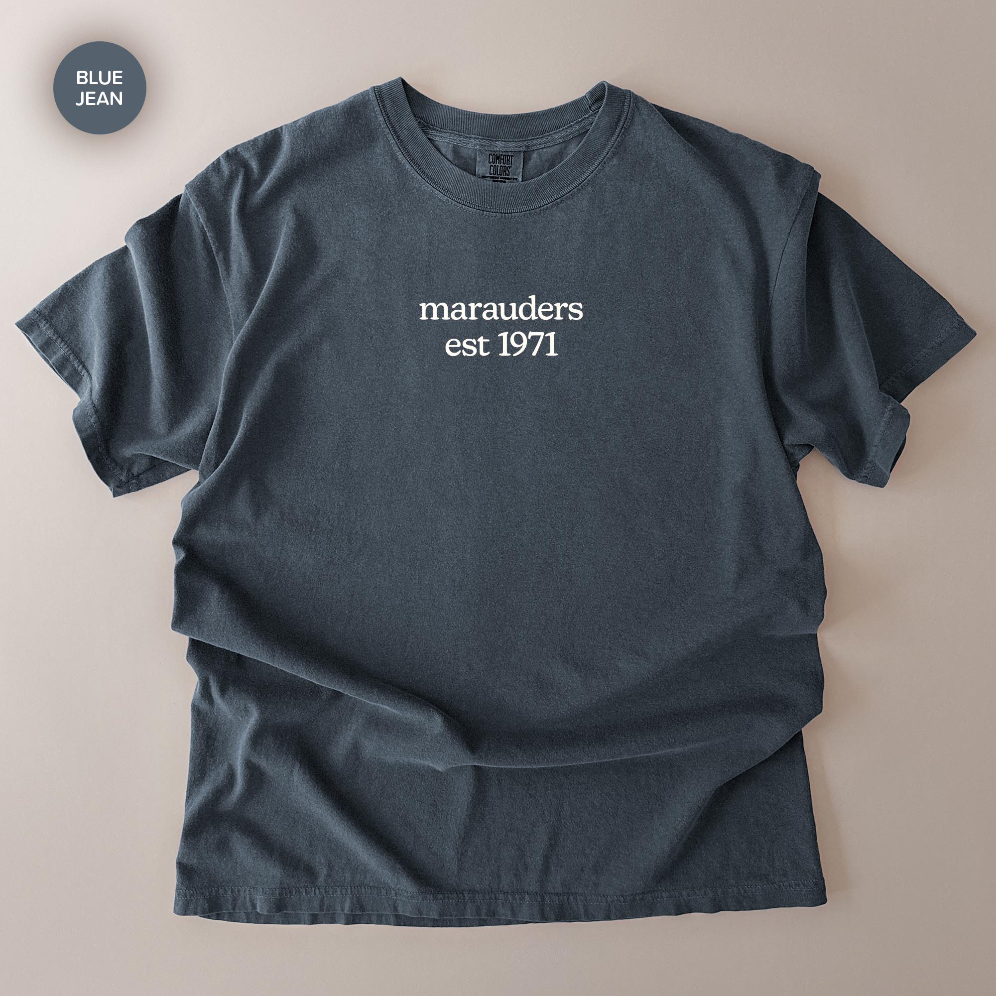 A dark blue t-shirt with the text "marauders est 1971" printed on it.
