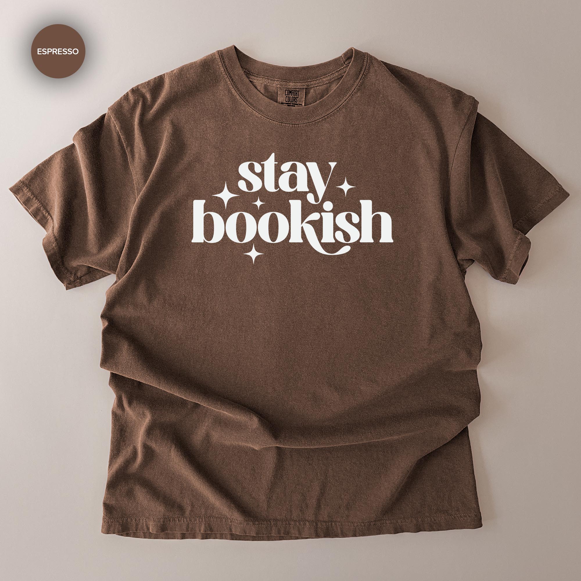 A brown t-shirt with the text "stay bookish" printed on it.