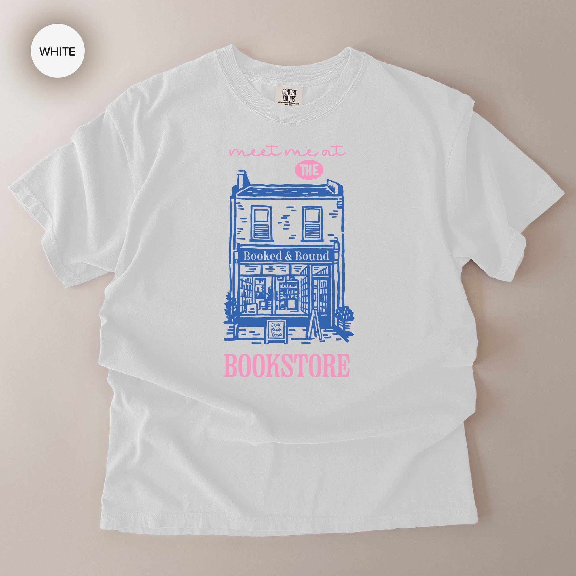 A white t-shirt with a graphic design depicting a building and the text "Bookstore" printed on it.