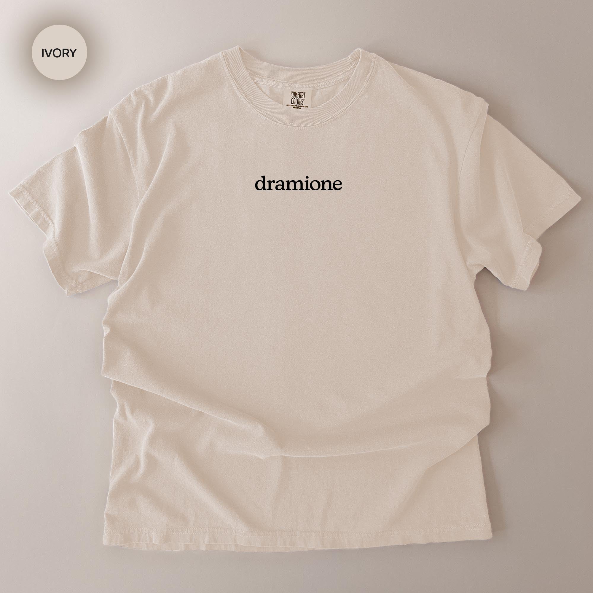A white t-shirt with the word "dramione" printed on it.