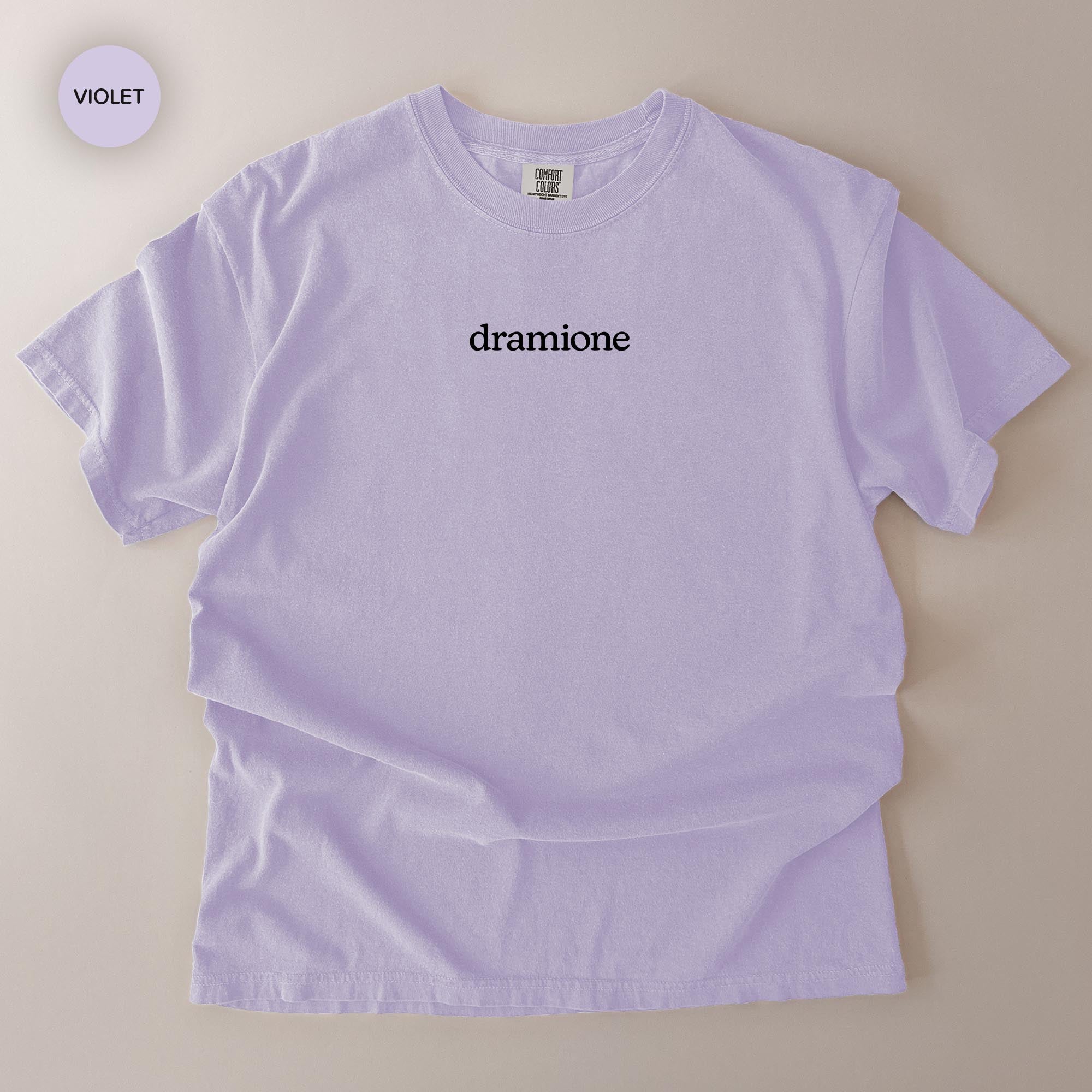 A light purple t-shirt with the word "dragonone" printed on it.